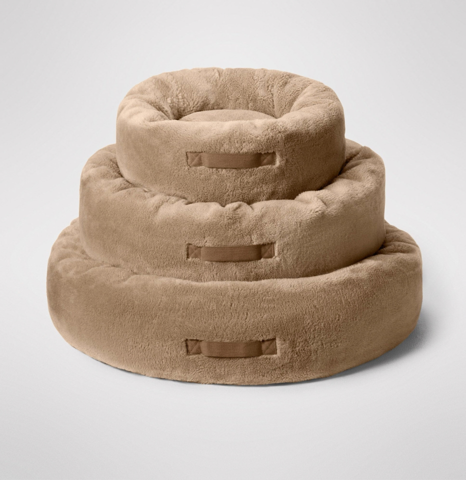 Stack of three MiniJumbuk Sleep Calm Oasis Wool Dog Bed – Fawn on a white background
