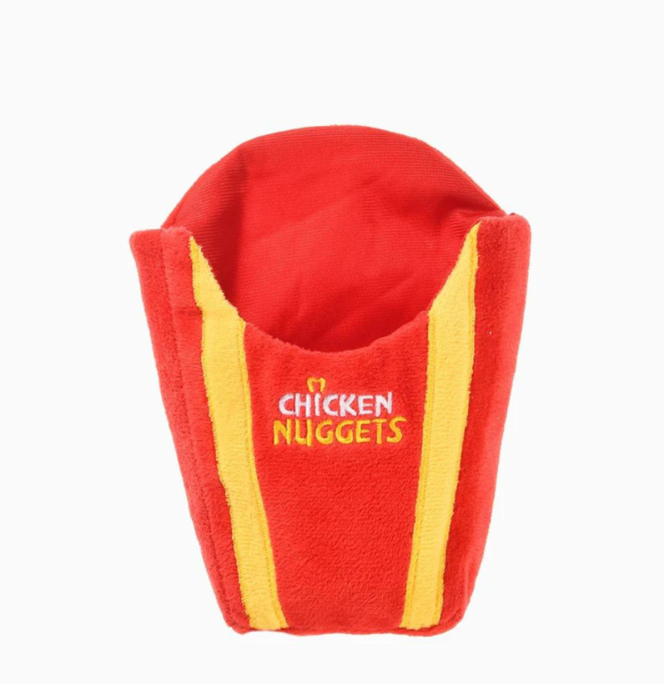 Hugsmart Food Party Chicken Nuggets dog toy bag, empty red and yellow plush bag on white background