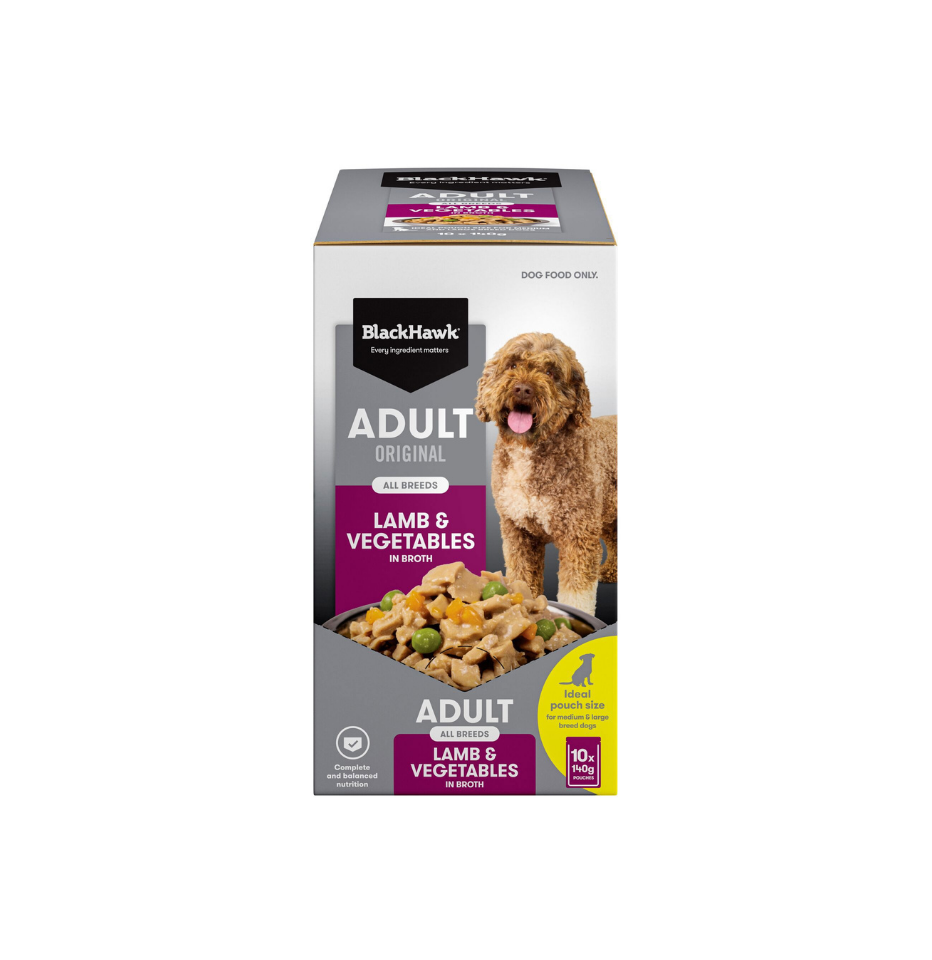 A box of BlackHawk Adult Original Lamb & Vegetables dog wet food, featuring a brown curly-haired dog on the front packaging against a plain white background.