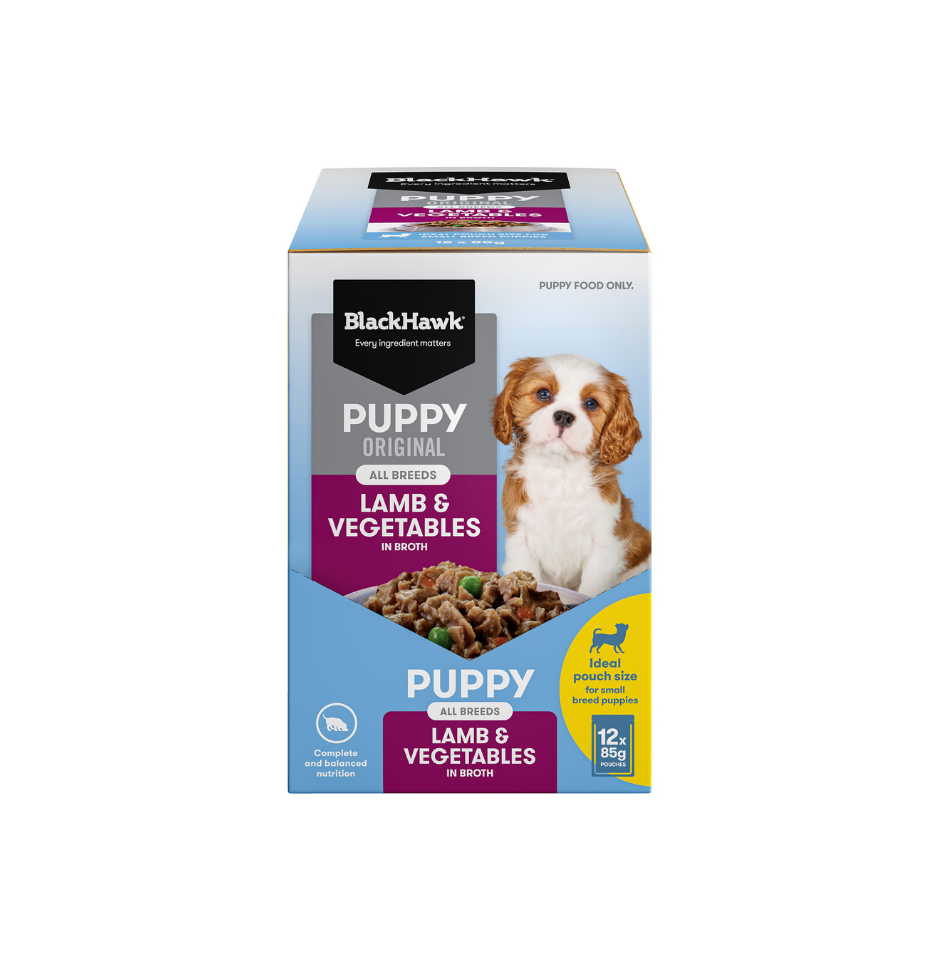 A box of BlackHawk Puppy Original Lamb & Vegetables wet dog food, featuring a blue and white design with a photo of a puppy, on a solid white background.