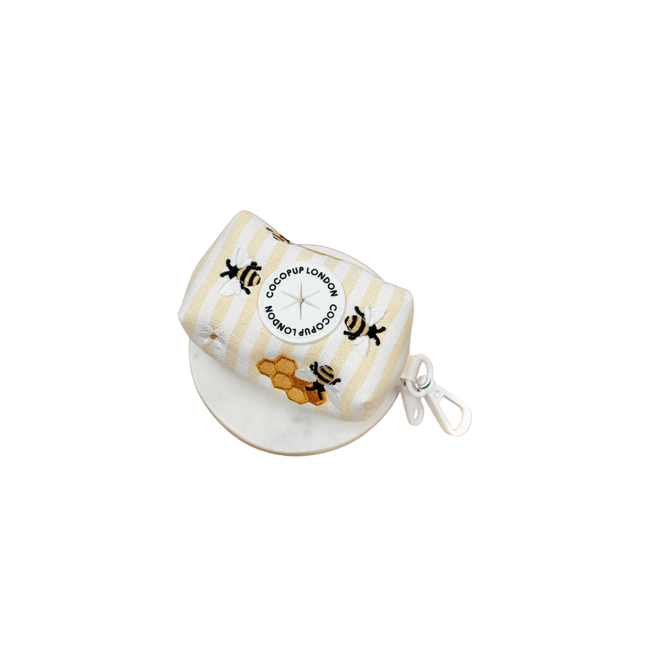 Cocopup London Honey Meadow poop bag holder, yellow and white stripes with embroidered bees and honey pots