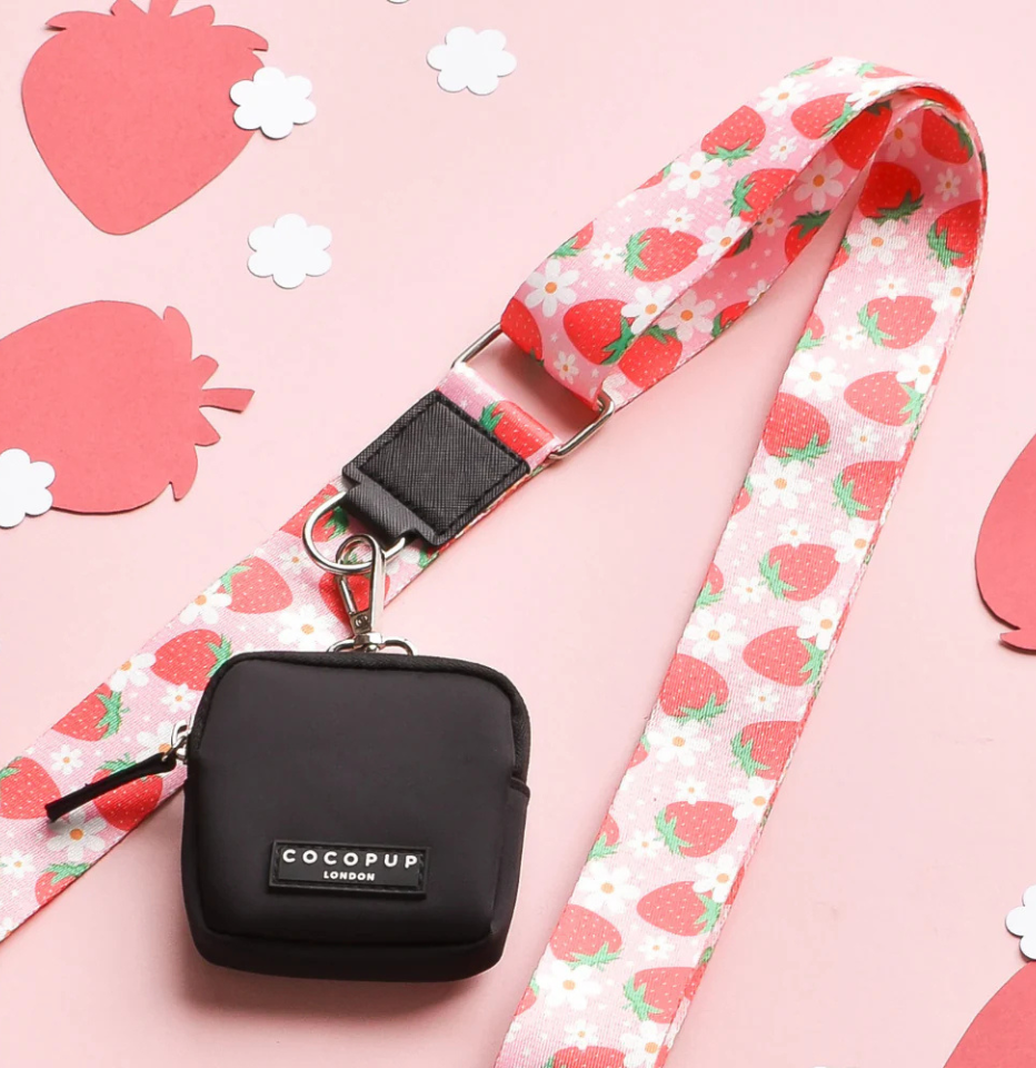 Cocopup London Pupberry Fields Walking Bag Strap on a pink background with decorative paper strawberries