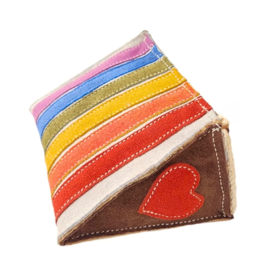 Georgie Paws Rainbow Cake dog toy, triangular suede toy with pink, blue, green, yellow, orange and red stripes, brown corner and red heart applique