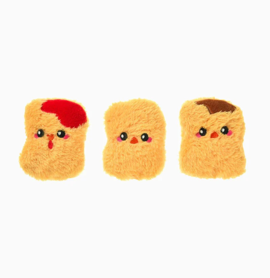 Hugsmart Food Party Chicken Nuggets dog toy, set of three plush nuggets on a white background