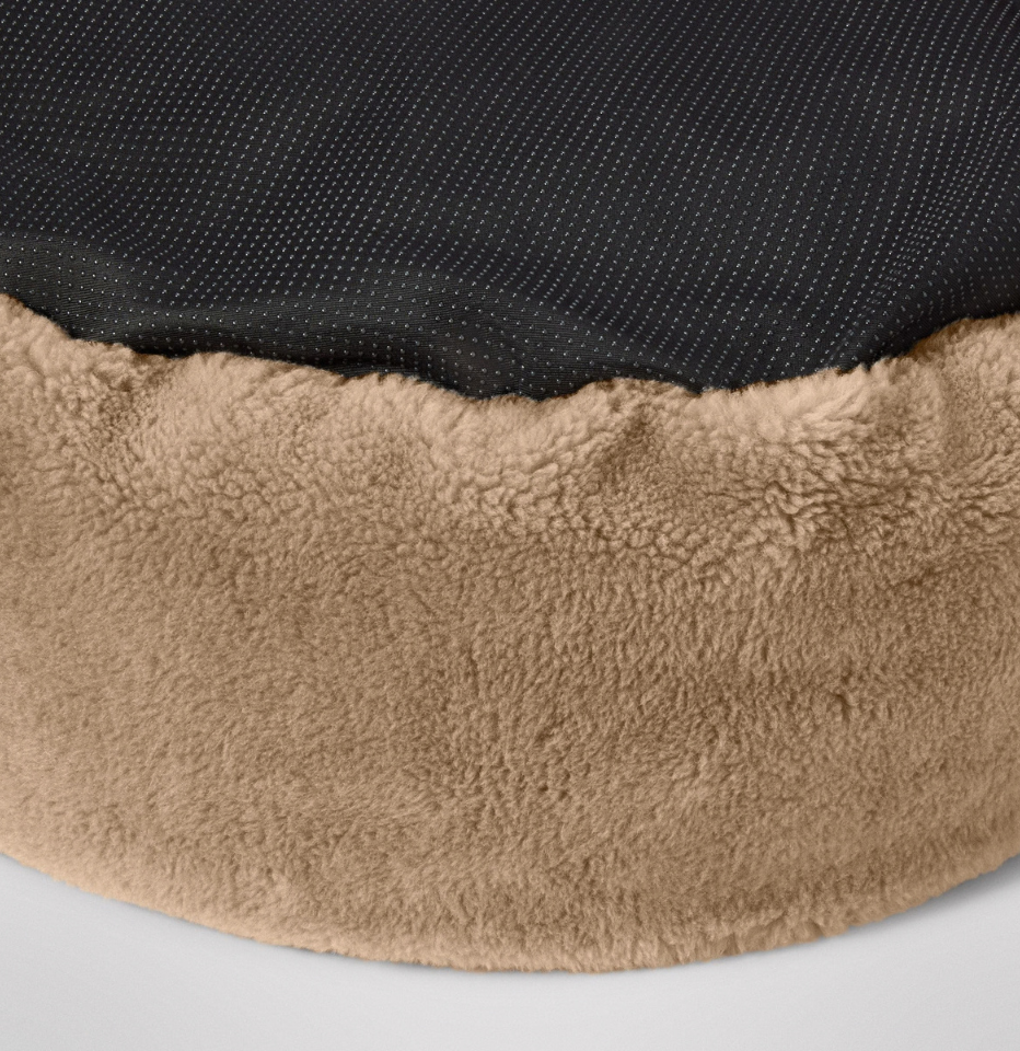 Close-up of a MiniJumbuk Sleep Calm Oasis Wool Dog Bed – Fawn showing a black mesh bottom surface.