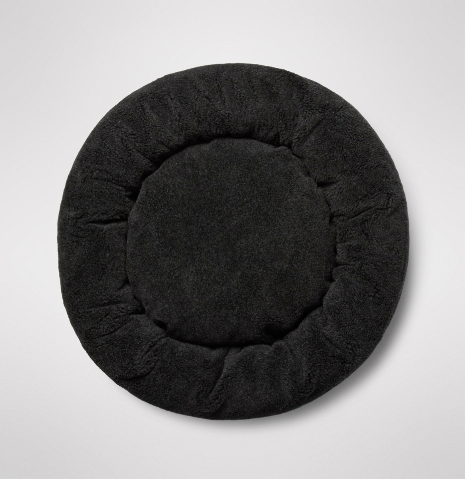 The top of a MiniJumbuk Sleep Calm Oasis Wool Dog Bed in storm grey in a white background